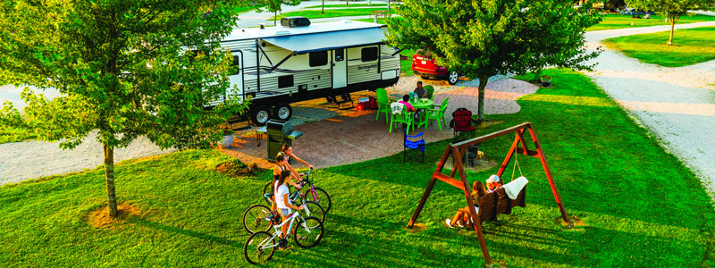 Family enjoying a campground with a Guest Guide